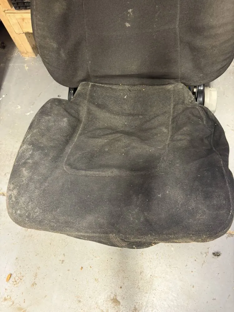 Before: Dirty worn black cloth seat
